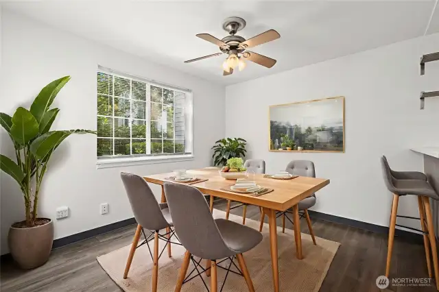 Sun-drenched dining area with convenient counter-height seating—perfect for casual meals or entertaining.