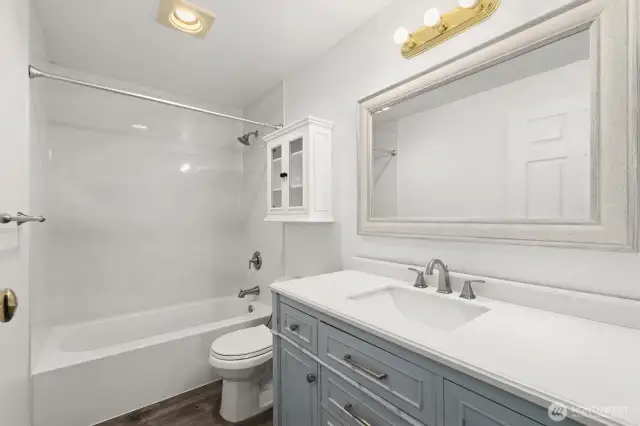 The primary ensuite bath features an updated vanity, adding a modern touch to your private retreat.