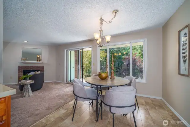 A stylish chandelier and easy-care vinyl flooring elevate the dining space.