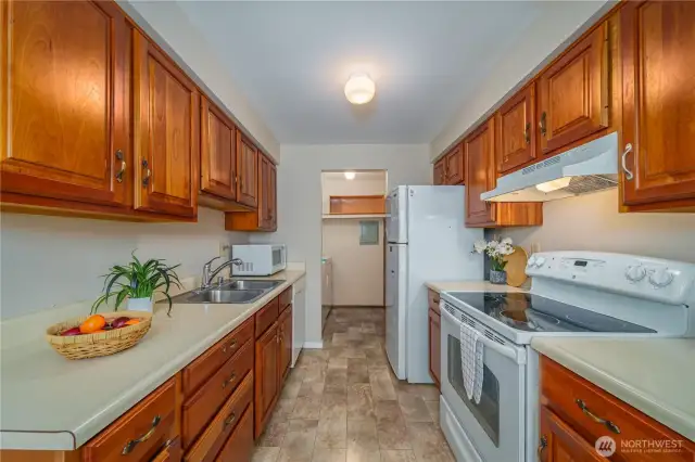 Just beyond the kitchen, a bonus utility/pantry room offers even more storage.