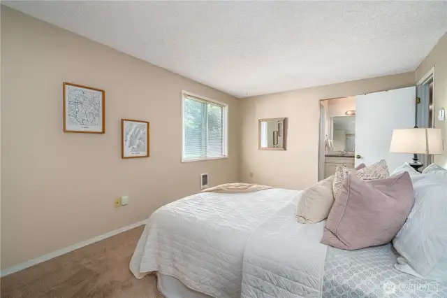 A large picture window and private ensuite bath make the primary suite a true retreat.
