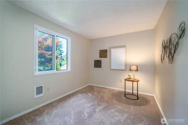 At the end of the hall, a third bedroom offers flexibility and a large closet.