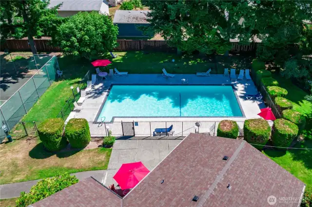 The sparkling outdoor pool is the perfect place to unwind and soak up the summer sun.