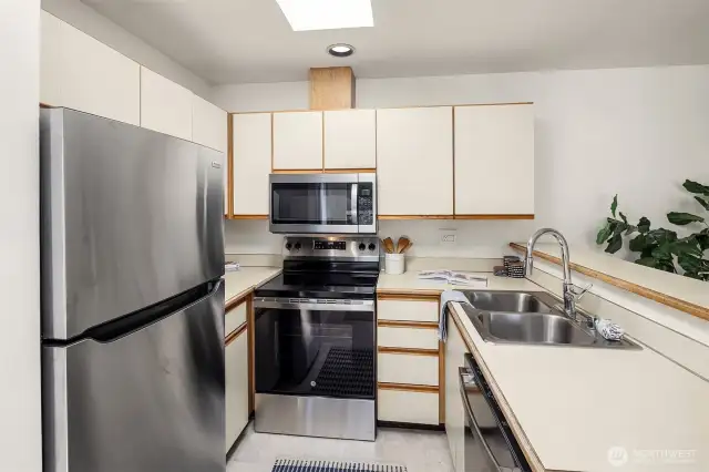 Functional kitchen with skylight and brand new appliances.