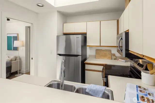 There's a pantry just to the left of the doorway.