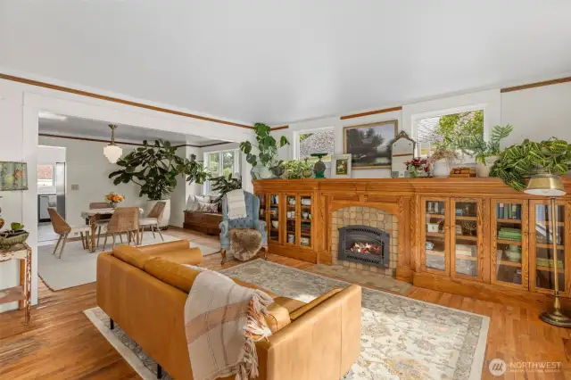 Original hardwood floors and trim flow throughout open living space