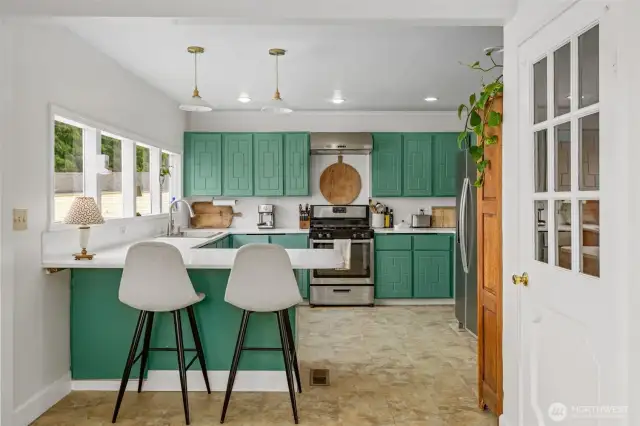 Bright kitchen offers plenty of storage and cooking space