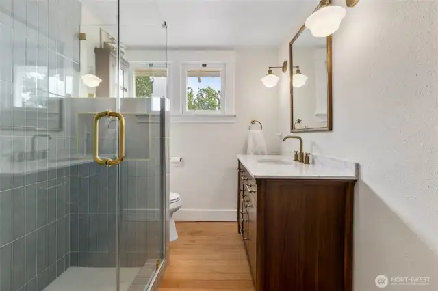 Newly renovated bathroom with high end finishes and custom tile
