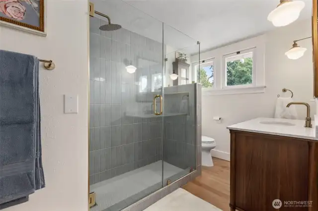 Newly renovated bathroom with high end finishes and custom tile