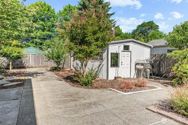 Fully fenced backyard with 2 outbuildings