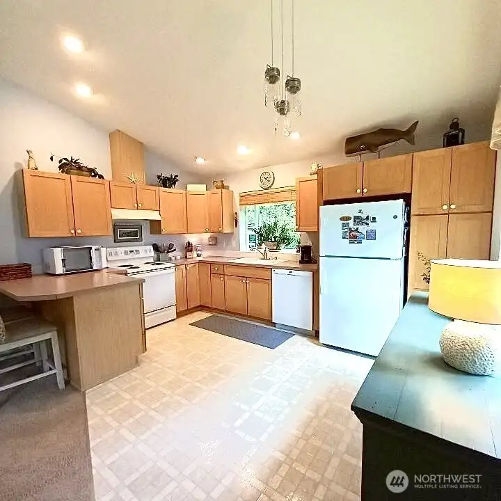 Spacious kitchen with ample storage and counter space.