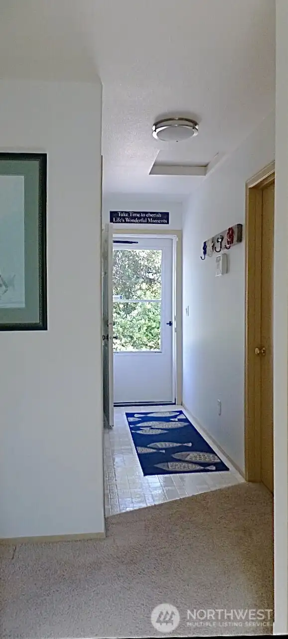 Side door from mud room/laundry area to side deck and driveway.