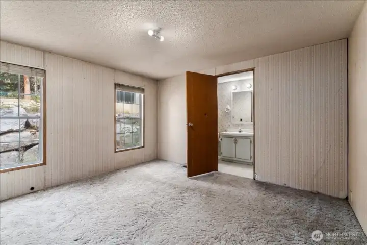 Primary bedroom looking towards private bathroom.