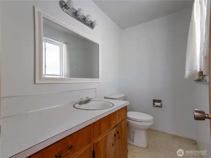 Half bath attached to the Primary Bedroom