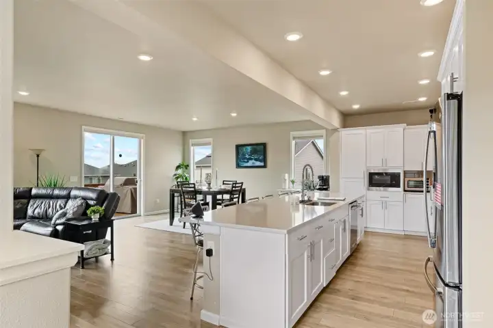 Grand chefs kitchen with SS appliances and quartz counters