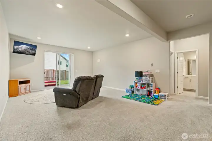 Large lower family room or playroom with outside access
