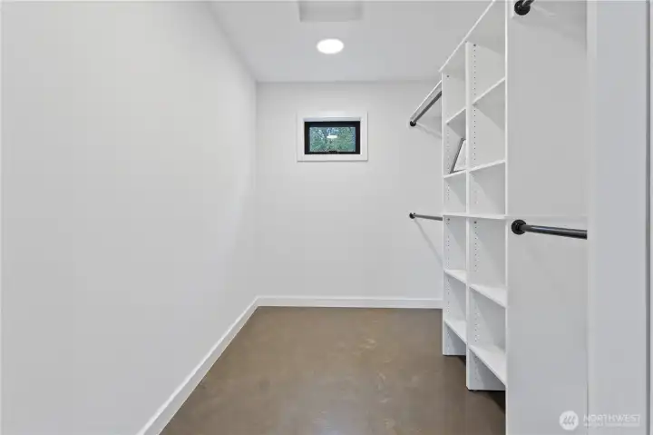 large walk-in primary closet.