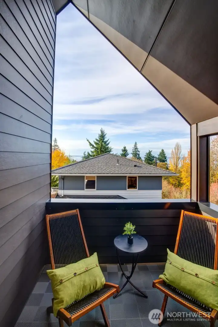 Your own oasis on the upper floor off the primary bedroom with sound and mountain views.