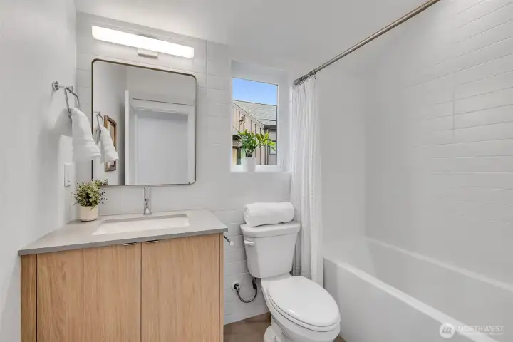Second bath with shower and tub on upper floor.