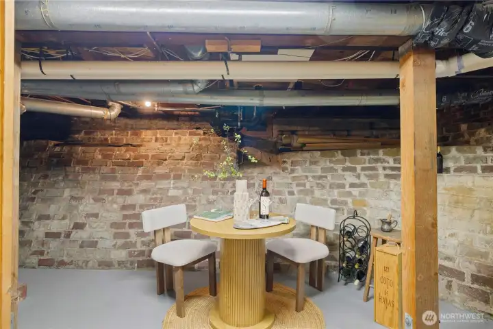 Lower-level storage/utility room with work bench.