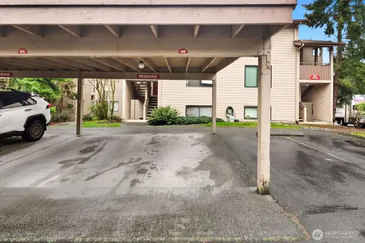 Designated, covered parking space sits just outside unit.