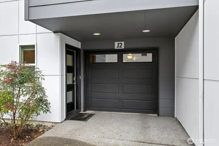 Unit offers covered driveway parking as well as a tandem 2 car garage.