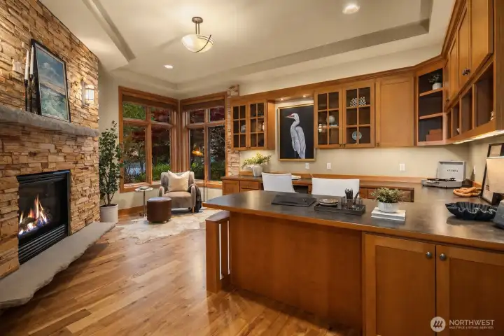 Large Main Floor Private Ofiice with Stone Gas Fireplace and Lake Views.
