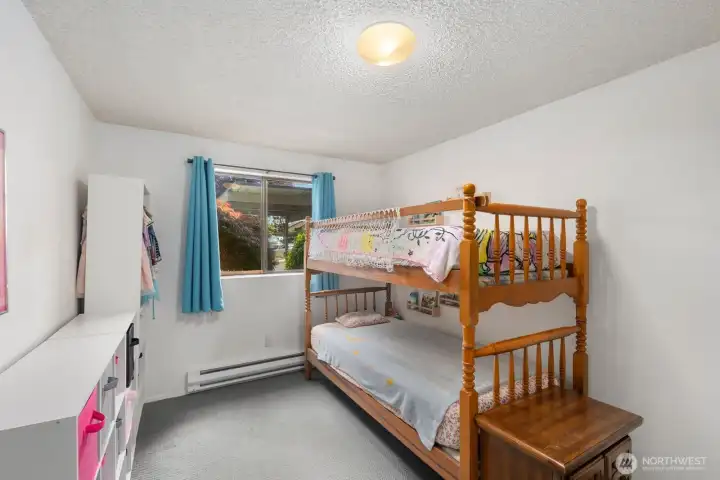 Bedroom with natural light, neutral tones, and flexible space for guests, hobbies, or a home office.