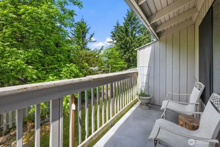 Covered outdoor space perfect for morning coffee or relaxing evenings outside.