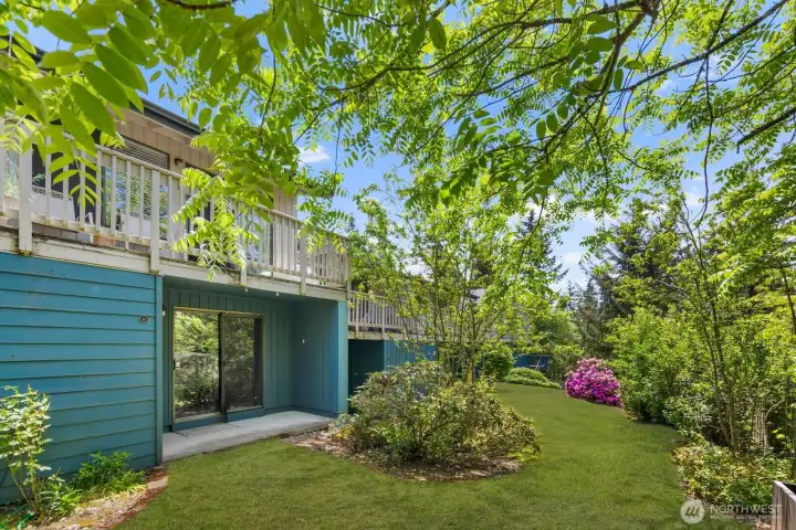 Tree-lined outdoor setting with established landscaping and a peaceful, park-like feel.