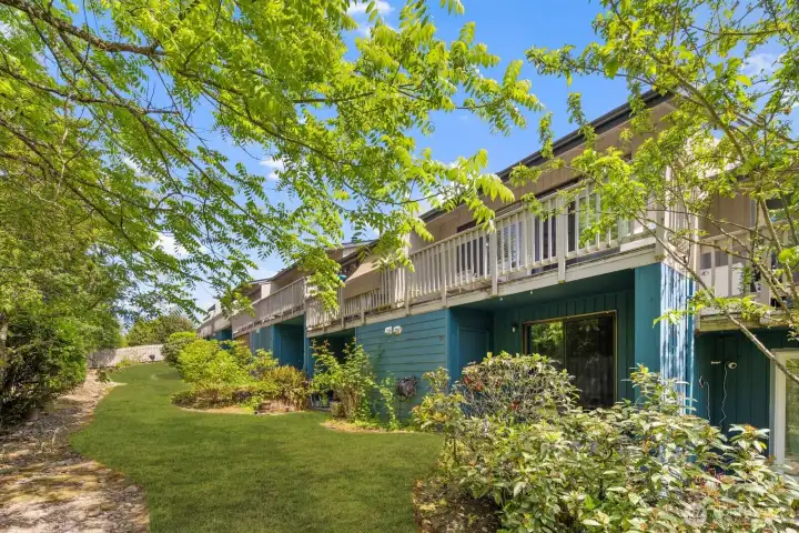 Exterior with private patio access and greenery just outside the door.