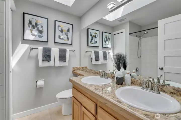 Full bathroom with double sinks