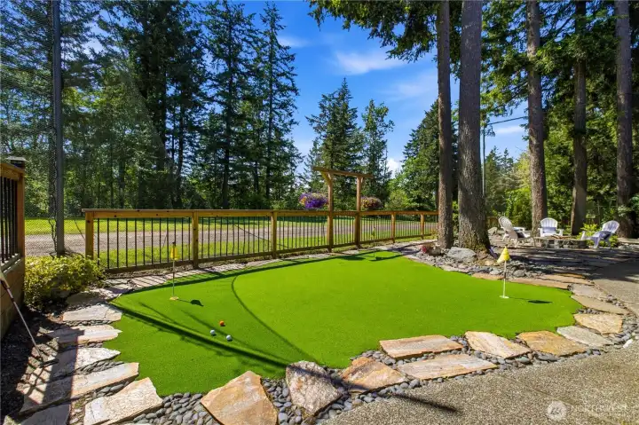 Golf anyone? Fun times practicing your putting on your own putting green.
