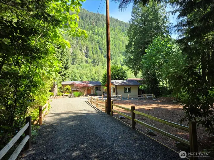 The long private drive is framed by a beautiful split-rail approach. The long private drive is framed by a beautiful split-rail approach.