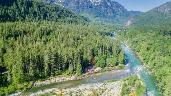 The river splits around the island on the bottom of pic, and comes back together just downriver from your property. The river splits around the island on the bottom of pic, and comes back together just downriver from your property.