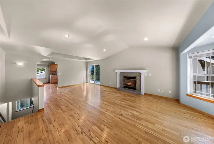 Main level, large living area with additional space for dining near sliding door and cozy gas fireplace. Main level, large living area with additional space for dining near sliding door and cozy gas fireplace.