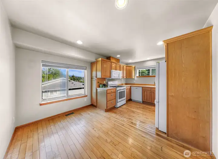 Kitchen with area for breakfast nook giving you flexibility on how you use you living and dining area Kitchen with area for breakfast nook giving you flexibility on how you use you living and dining area