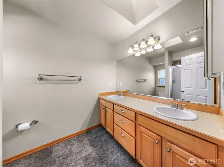 Primary bath with dual vanity and skylight for lots of natural light! Primary bath with dual vanity and skylight for lots of natural light!