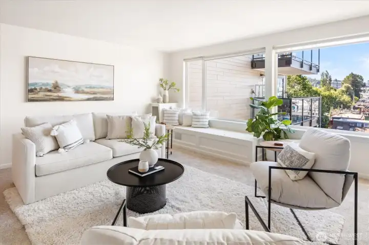 Spacious living room looking out south with plenty of natural daylight covering this space.
