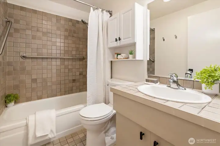 Bathroom just off the bedroom and living spaces.