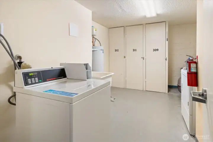 Across the hallway from the storage unit and down the hallway from your condo is the laundry room.