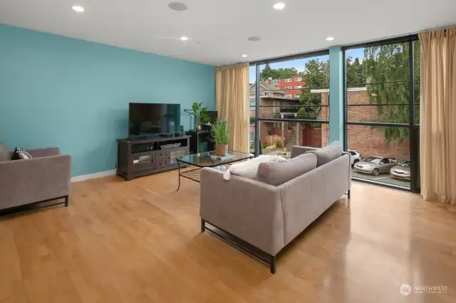 Gleaming hardwoods and floor to ceiling windows.