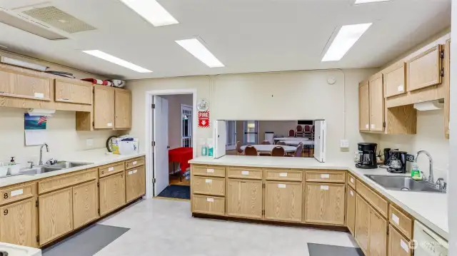 Fully equipped kitchen with serving counter. to the fellowship hall available for your use.