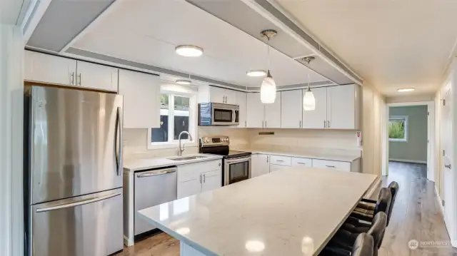 Remodeled kitchen with all stainless steel appliances, Quartz counter tops and new lighting.