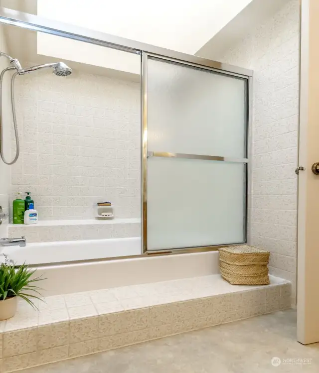 The full bath has a skylight that makes the shower/soaking area light and bright.