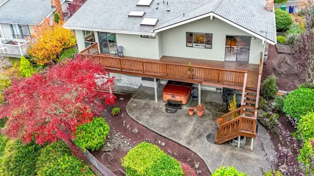 Lovely landscape graces this home's exterior. Plan to entertain on your upper deck and lower patio with hot tub.