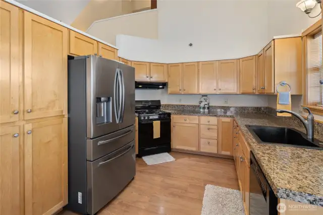 This handsome kitchen offers ample cabinet and storage space.