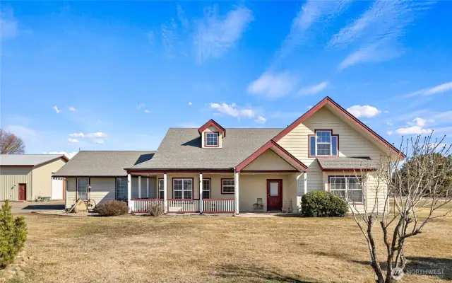 Wrap around porch leads to front entry.