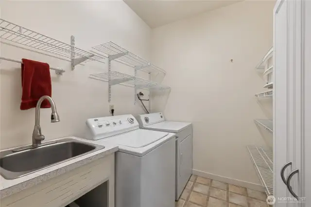 Laundry/utility room with shelving.
