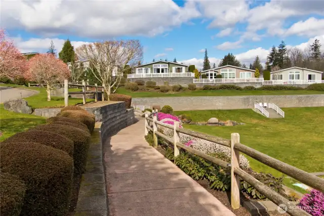 Pathways wind through the gardens and waterfalls for both daytime and evening beauty.